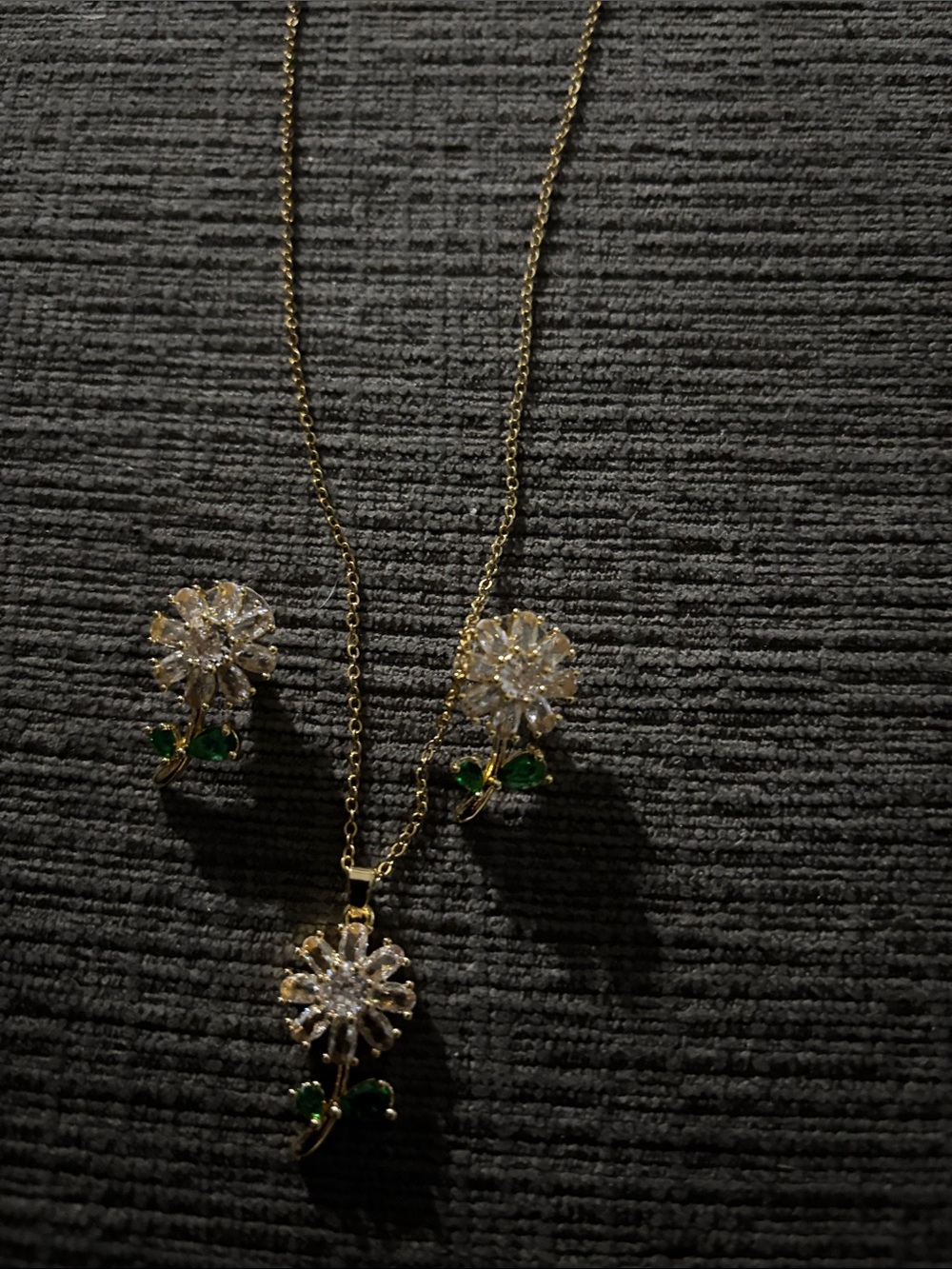 Gold Flower Crystal Necklace and Earring Set with Green Leaf Accents